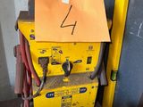 a yellow box with a sign on top of it
