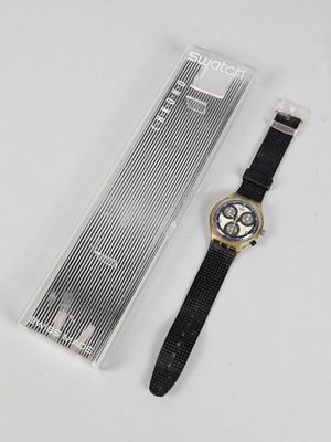 an image of a watch with a black strap next to a plastic case