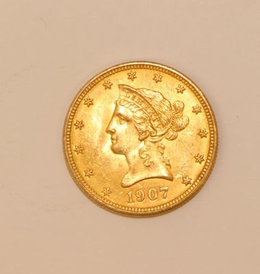 an image of a gold coin with a woman ' s head on it