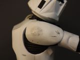 a star wars action figure that is posed on a black background