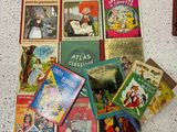 many children ' s books laid out on the floor