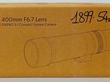 a box with a camera lens sitting on top of it