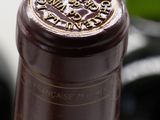 a close up of a bottle of wine on a table