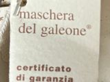 a tag that says maschera del galone on a plate