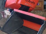 a red suitcase that is sitting on top of a cart