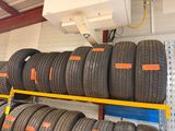 a lot of tires on the shelves in the store