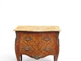 an antique chest of drawers with marble top