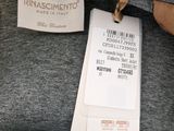 a close up of a label on a gray shirt