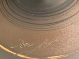 a close up of a glass vase with a candle inside of it