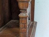 a wooden table with a clock on top of it