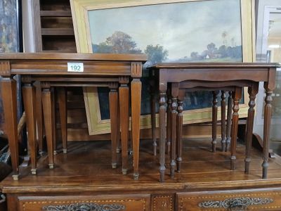 two tables that are sitting on top of a dresser