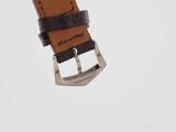 a close up of a watch strap with a buckle on it