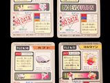four cards with japanese characters on them on a black background