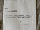 a close up of a piece of paper with a letter on it
