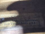 a shadow of a person on the floor of a building