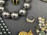 many different types of jewelry on a table