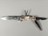 a knife that is laying on top of a table