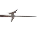 a large metal sword with a wooden handle on a white surface