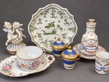 a group of porcelain items that are sitting on a table