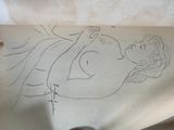 a drawing of a woman laying down on a sheet of paper