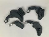 four different types of hand tools sitting on a white surface