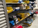 many boxes and bins on the shelves in the garage
