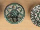 three cups that are sitting next to each other on a table