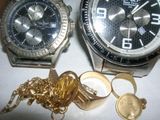 two watches that are sitting next to each other on a table