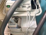an image of a machine with a hose attached to it ' s side