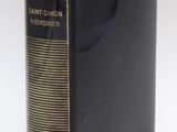 a close up of a book on a white surface with a white background
