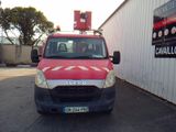 a red van that is parked in front of a building