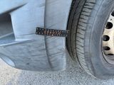a measuring tape on the tire of a truck