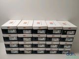 several boxes of different sizes and colors of electronic devices stacked on top of each other