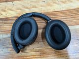 a pair of headphones sitting on a wooden table