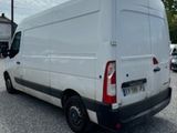 a white van that is parked in a parking lot