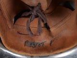 a close up of a baseball glove with a tag on it