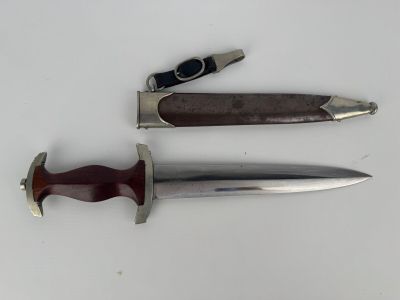 a knife and a knife holder on a table