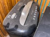 a black toaster sitting next to a black toaster on a counter