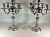 pair of silver plated candelabs with candlesticks in the shape of angels