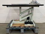 a close up of a machine on a pallet in a warehouse