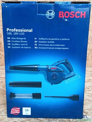 a box of bosch professional brush and blower on a wooden surface
