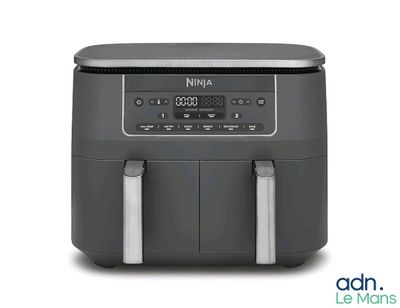 a close up of an air fryer on a white background