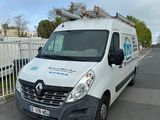 a white van that is parked on the side of the road