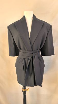 the jacket is black and has a belt around it