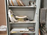 a metal cabinet with a bunch of items on top of it