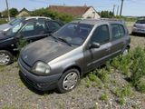 a small car that is parked in a lot