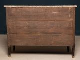 an old wooden chest of drawers with a marble top