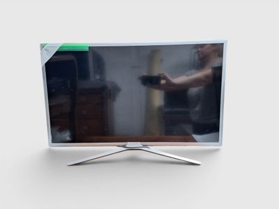 un téléviseur à écran plat posé sur un meuble, sur une surface blanche