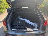 a trunk of a car with luggage in the trunk