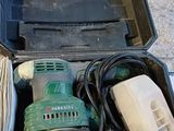 a tool box with tools in it sitting on the ground